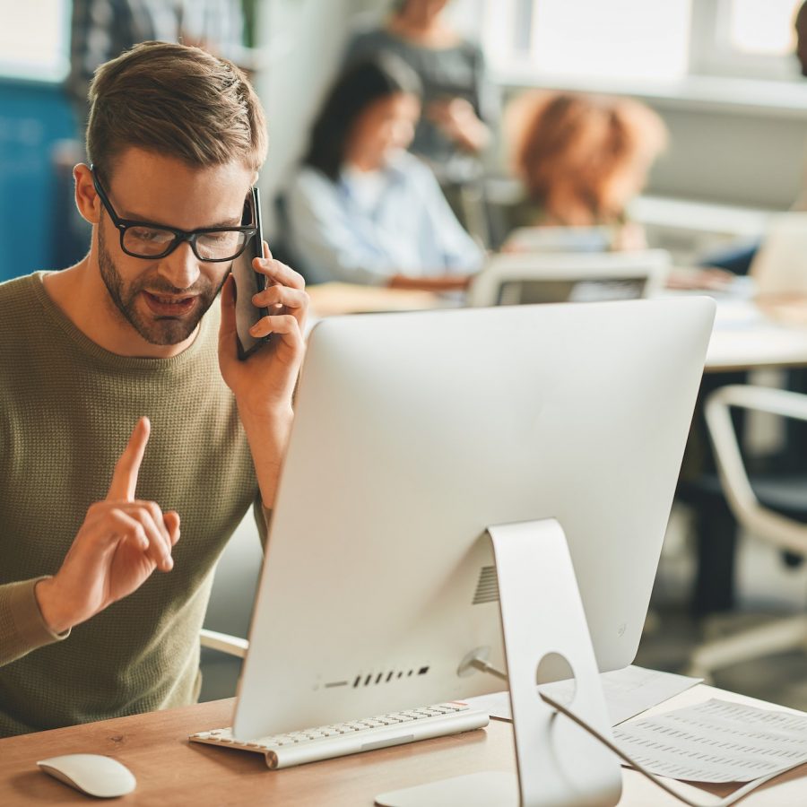 Patient call-center operator gesturing during a phone-call Patient call-center operator gesturing during a phone-call